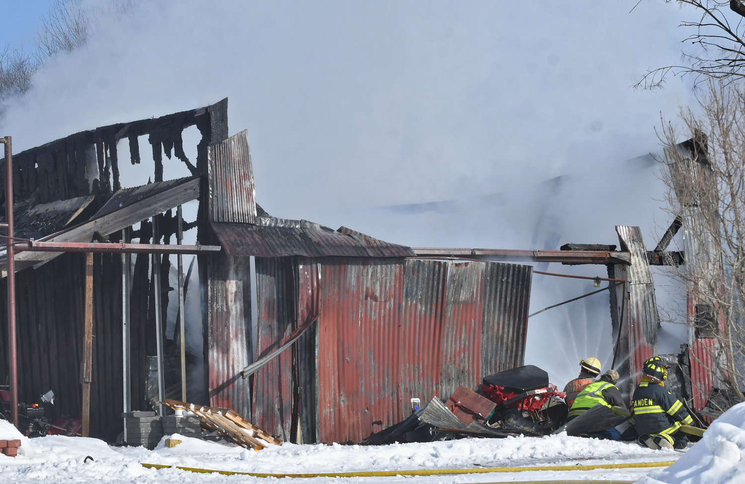 Volunteer firefighters from Florence and Camden blast water into a barn fire at the corner of Thompson Corners-Florence and River roads Wednesday afternoon. The alarm was raised at 1:10 p.m. for a fully involved barn fire, and officials said it was under control by 1:50 p.m. The barn was heavily damaged. The cause remains under investigation. The Florence, Camden and Taberg fire departments responded.