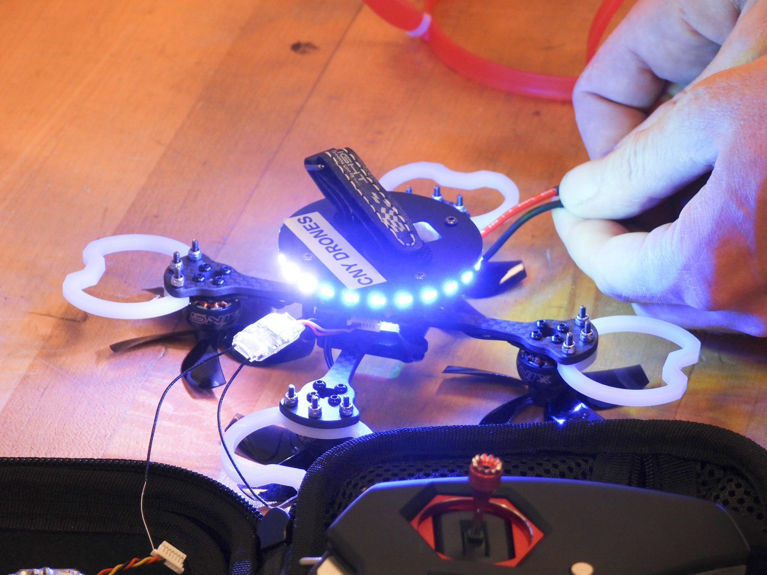 One of the quadcopter drones owned by CNY Drones is turned on