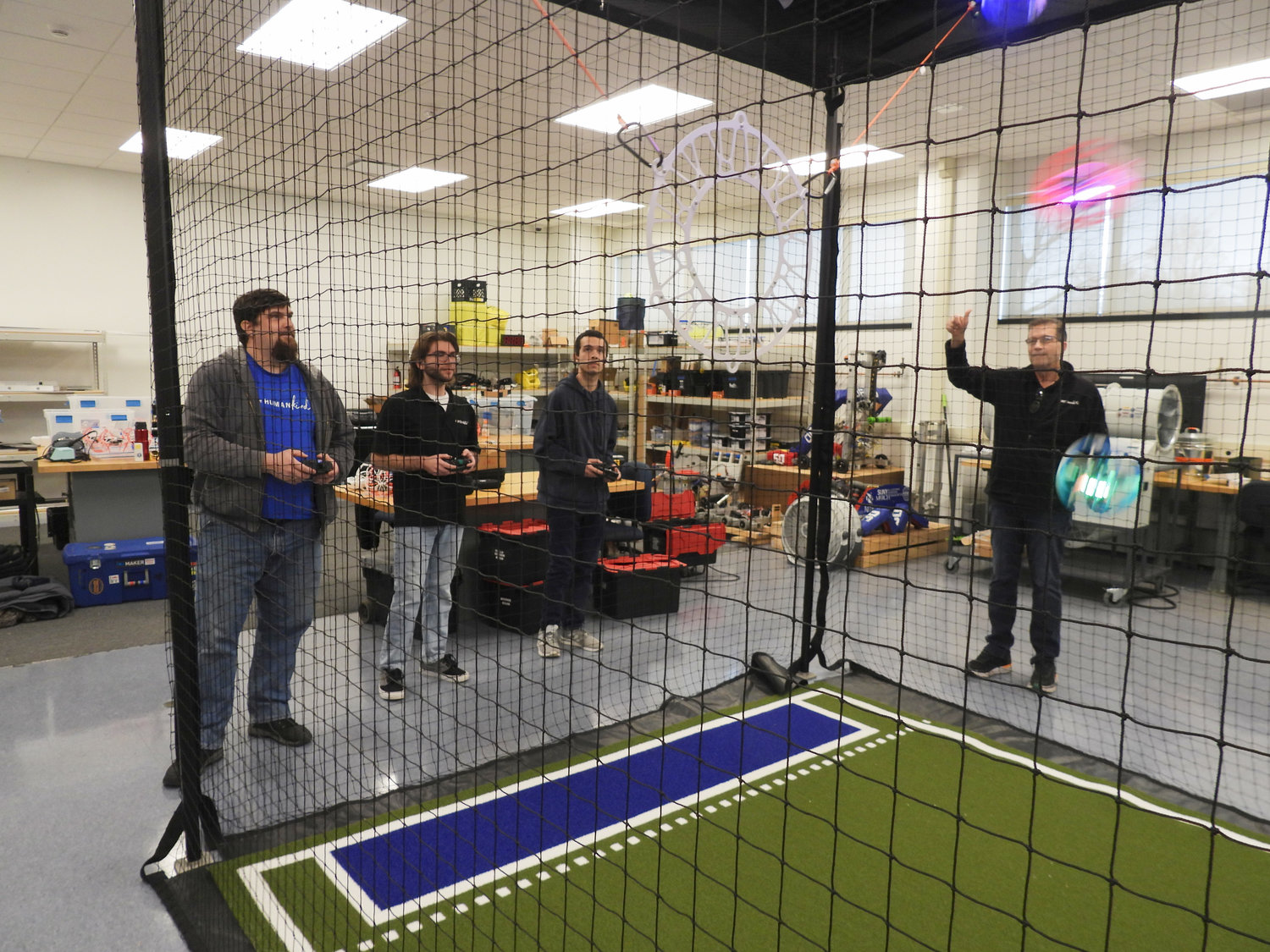 A practice match is held at SUNY Polytechnic with CNY Drones. Pictured Left to Right: John Franklin, student at SUNY Poly, CNY Drones member Gaetano Viti, Edwin Martinez-Vazquez, student at SUNY Poly and member of the AMA Drone Student Club, Robert Payne, co-founder of CNY Drones and adjunct instructor in the mechanical engineering technology department at SUNY Polytechnic