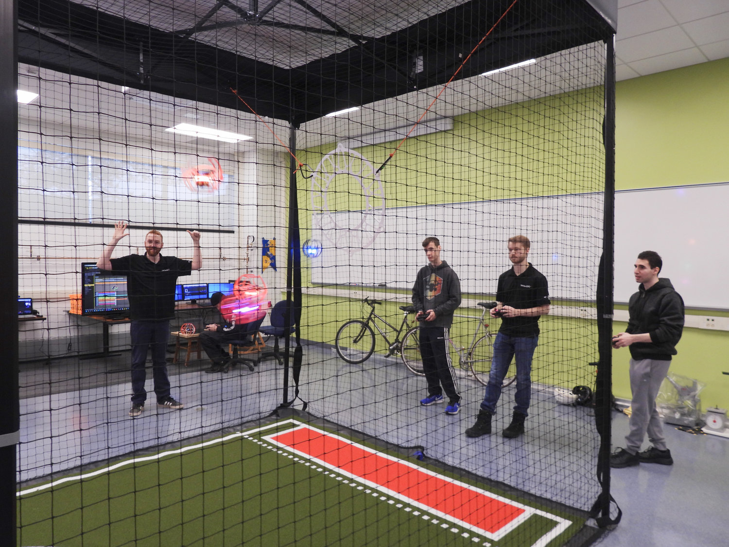 A practice match is held at SUNY Polytechnic with CNY Drones. Pictured Left to Right: John Reade, CNY Drones planning committee member and director of IT at Quanterion Solutions, Cameron Rogers-Duell, student at SUNY Poly and president of the AMA Drone Student Club, Ryan Payne, CNY Drones member and equipment engineer at Wolfspeed, Matthew Sayar, student at SUNY Poly and treasurer of the AMA Drone Student Club