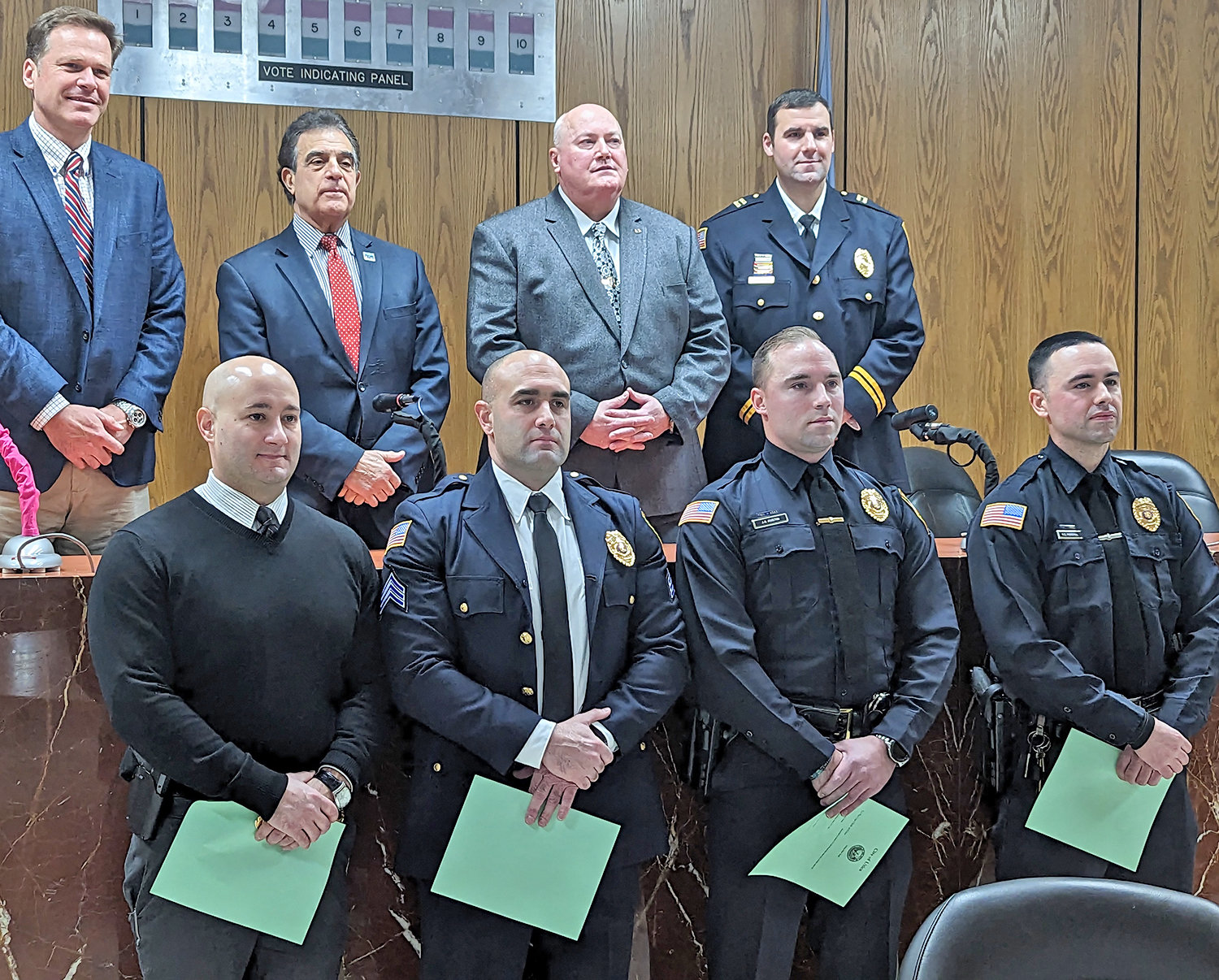 Four Utica police officers were promoted to new positions Friday morning. From left, front, Capt. Stanley Fernalld, Lt. Michael Curley, Sgt. Joshua Austin and Sgt. Kyle Piersall. In back are, from left, Deputy Chief Edward Noonan, Utica Mayor Robert Palmieri, Chief Mark Williams and Capt. Brian Bansner.