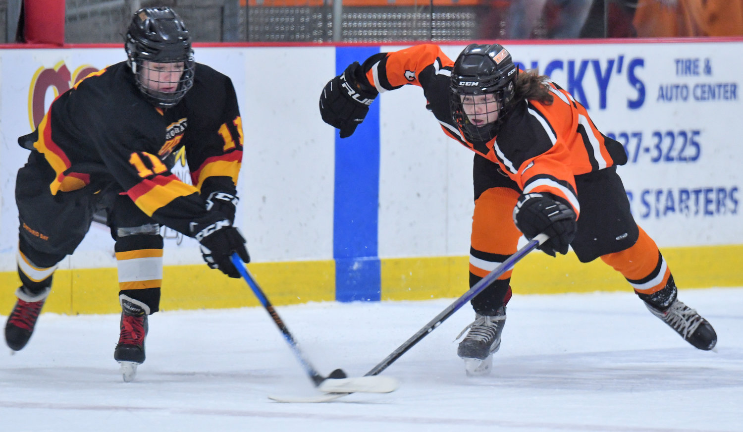 Ontario Bay's Codie Mashaw, left, and Rome Free Academy's Johnny Wilson race for the puck in the first period Tuesday night at Kennedy Arena. Wilson had two primary assists but it wasn't enough, as RFA lost 5-4 in overtime.