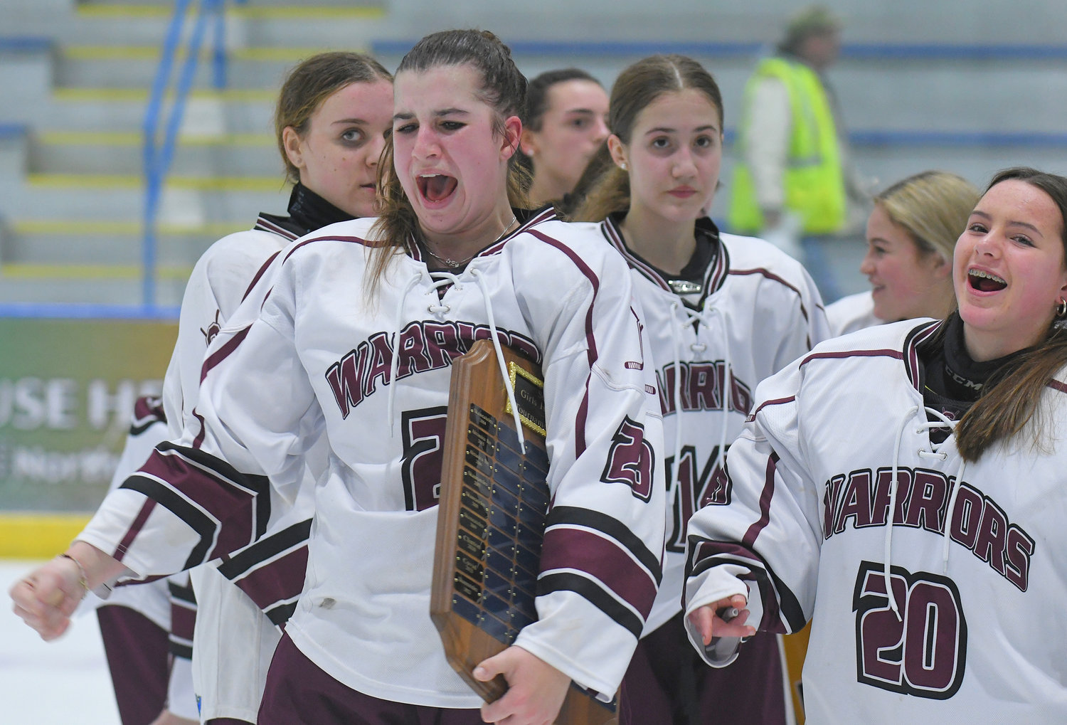 Clinton's Mackinley Ronan clutches the Section III girls ice hockey championship plaque and shouts during the team's celebration after defeating the Skaneateles Lakers Wednesday in Nedrow. Ronan, a sophomore who attends New Hartford and plays for the unified Clinton team, had the overtime goal that won the game 1-0.