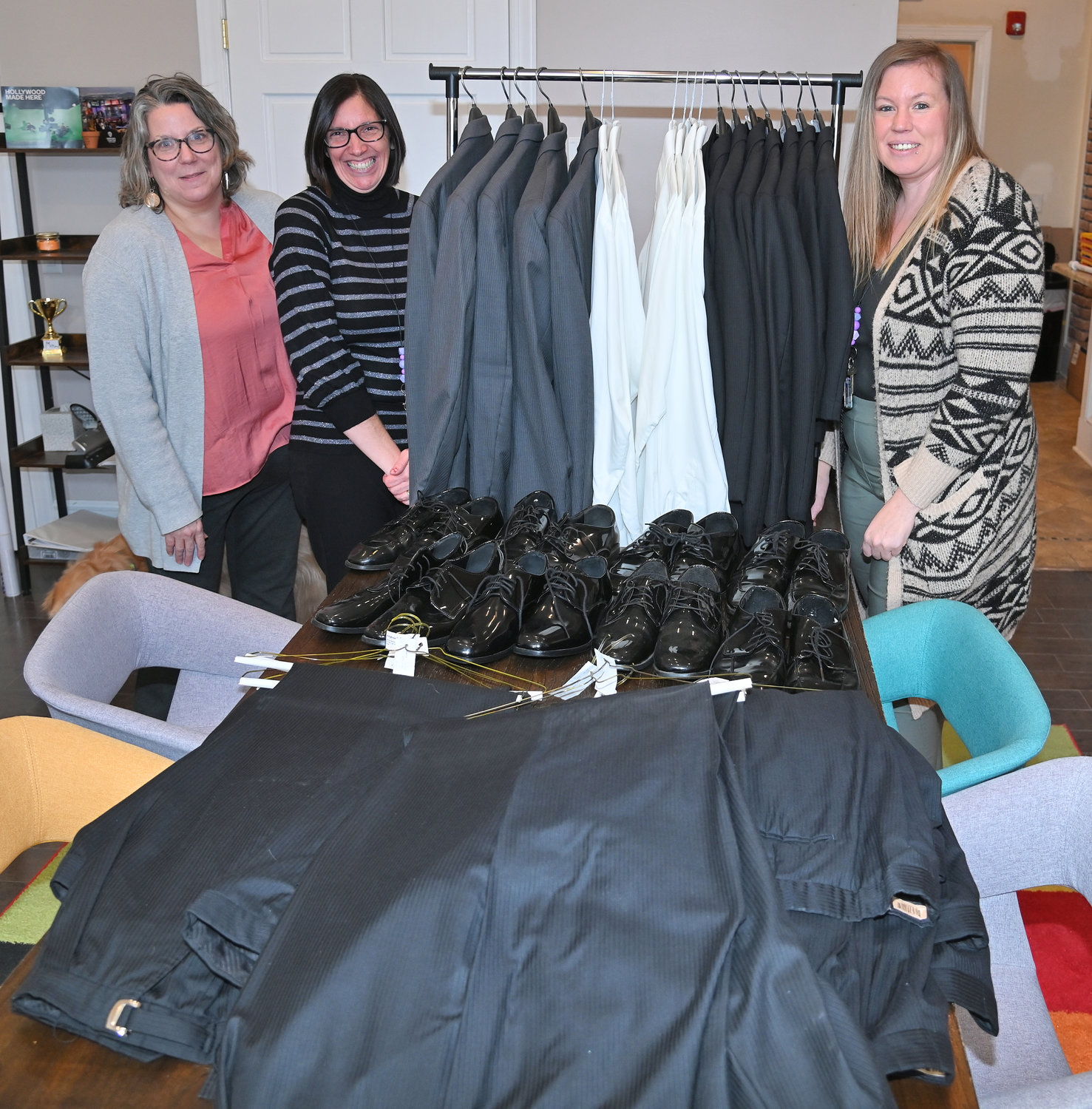 Community Connected Schools recently received donated tuxedos from A Vitullo in New Hartford and they are almost ready to go to the prom. From left are Sarah Smith, project manager from Holland Patent; Kim Streates from the middle school and Amanda Steele, site coordinator from Holland Patent High School.