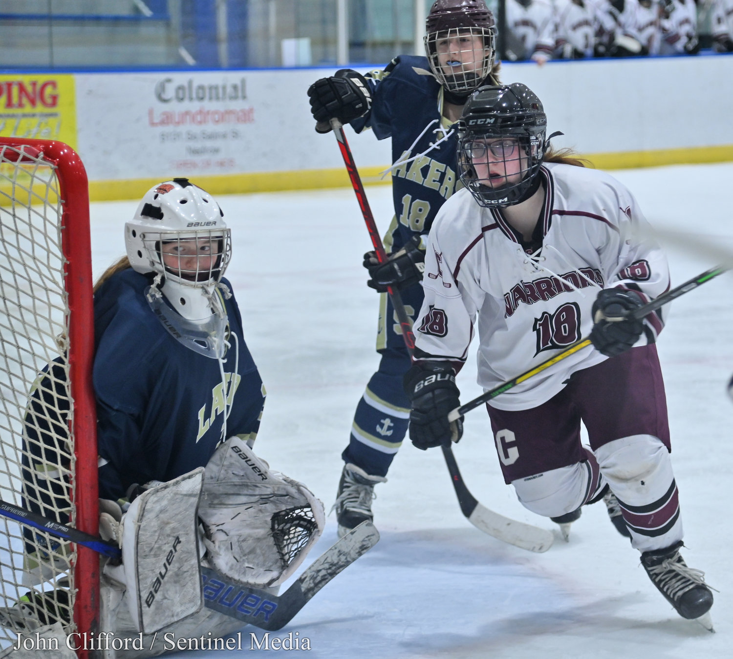 The Clinton Warriors in action against the Skaneateles Lakers in the Section III girls ice hockey championship Wednesday night in Nedrow. Clinton beat Skaneateles 1-0 in overtime.