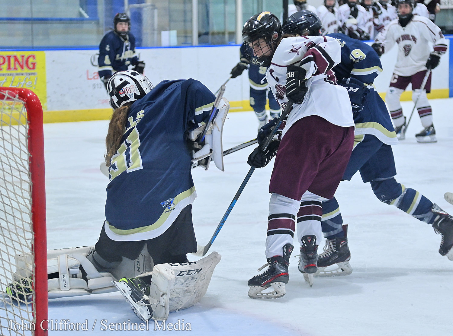 The Clinton Warriors in action against the Skaneateles Lakers in the Section III girls ice hockey championship Wednesday night in Nedrow. Clinton beat Skaneateles 1-0 in overtime. Clinton #22 watches the puck with Lakers #31 making the save.
