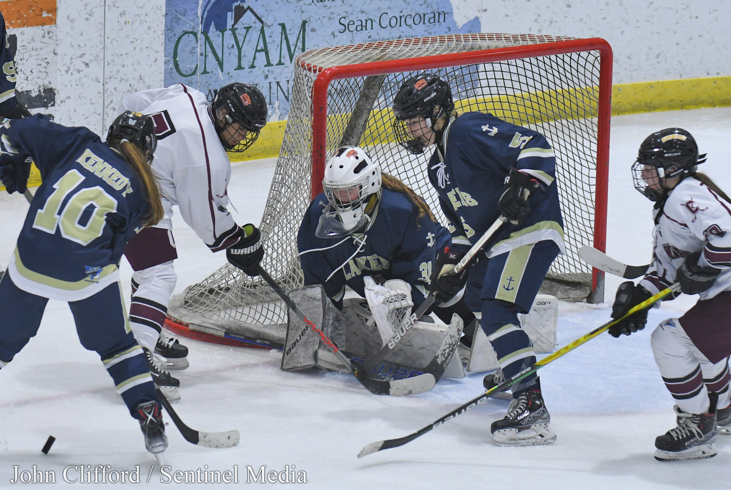 The Clinton Warriors in action against the Skaneateles Lakers in the Section III girls ice hockey championship Wednesday night in Nedrow. Clinton beat Skaneateles 1-0 in overtime.