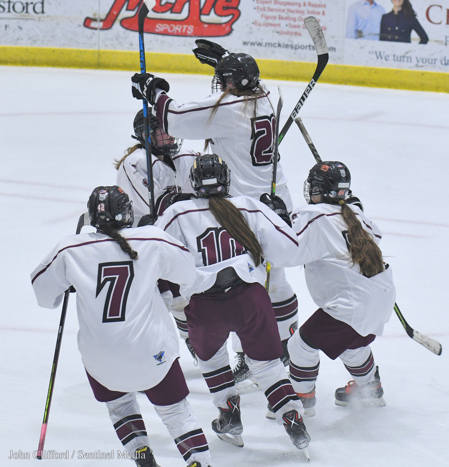 The Clinton Warriors celebrate their Section III girls ice hockey championship Wednesday night in Nedrow. The team beat Skaneateles 1-0 in overtime.