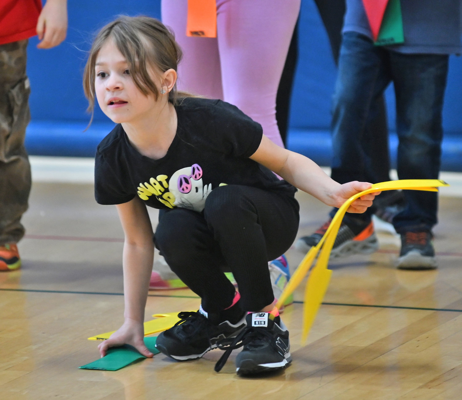 Vera Fellows, 7, plays a game with other homeschooled children during Home Zone gym classes Wednesday, Feb. 8 at the YMCA in Oneida.