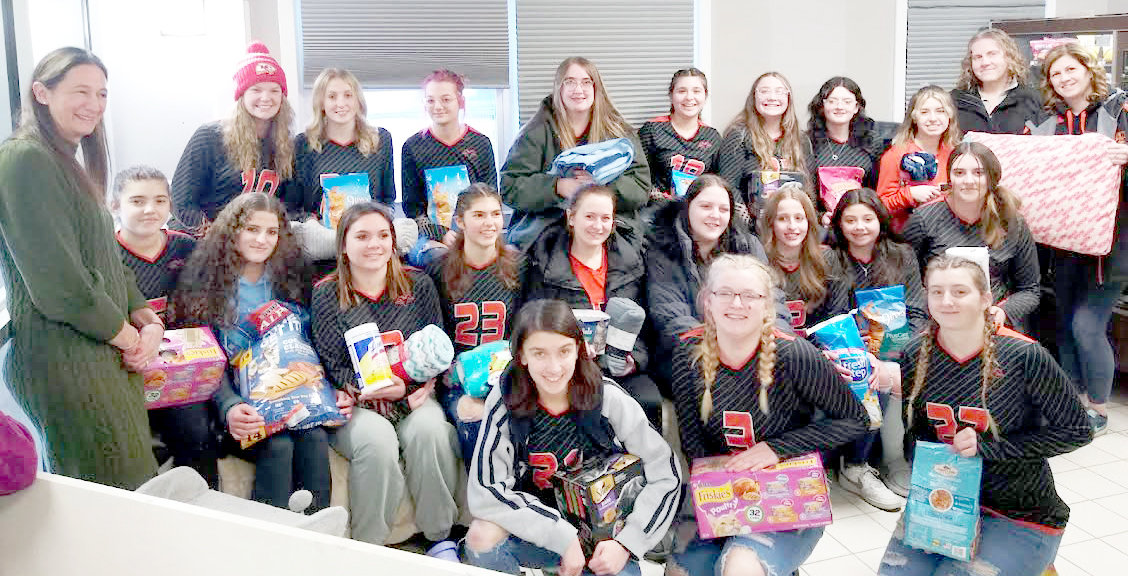 The Remsen Central School JV and varsity volleyball teams delivering their donations to the Anita’s Stevens Swan Humane Society.