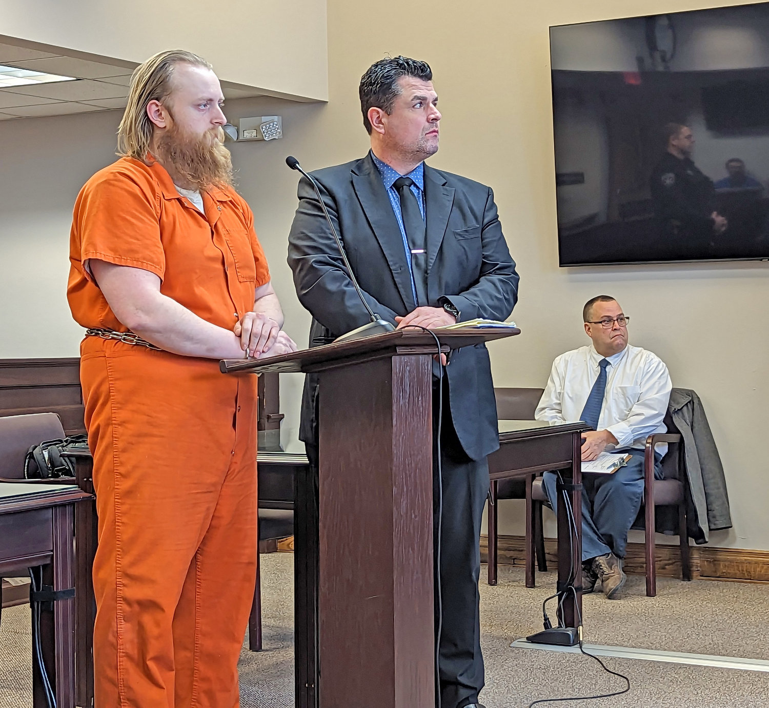 Matthew Westcott and his defense attorney, Adam Tyksinski stand in Oneida County Court Friday morning to await Westcott's sentencing. Westcott stood by his claim that he killed his brother to protect the rest of the family.