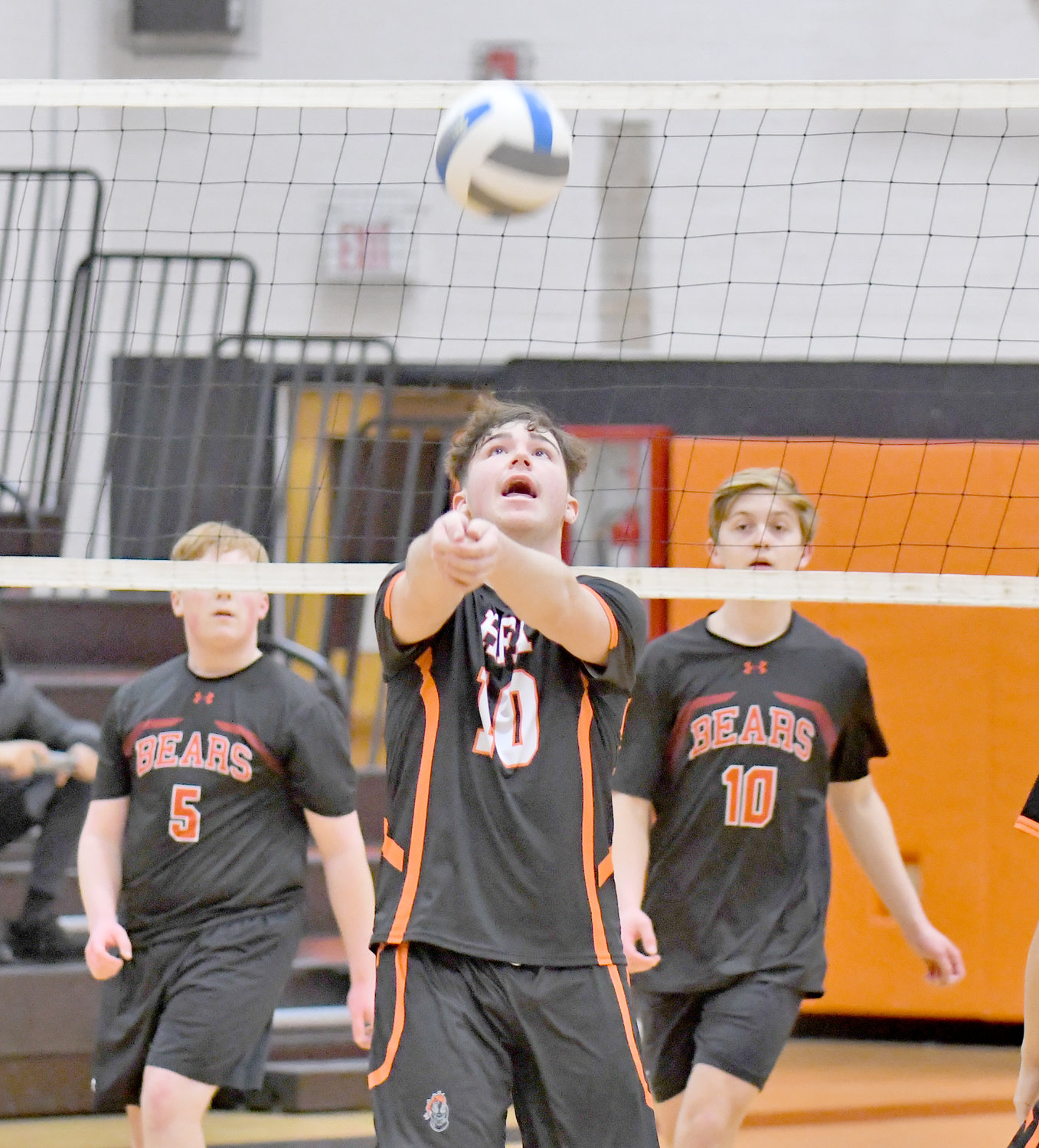 Rome Free Academy’s Casey Podkowka looks to set up a shot against Chittenango in Rome on Thursday. Chittenanago’s Roger Mulholland, left, and Cole Thomas are in the background. Chittenango won in three sets.