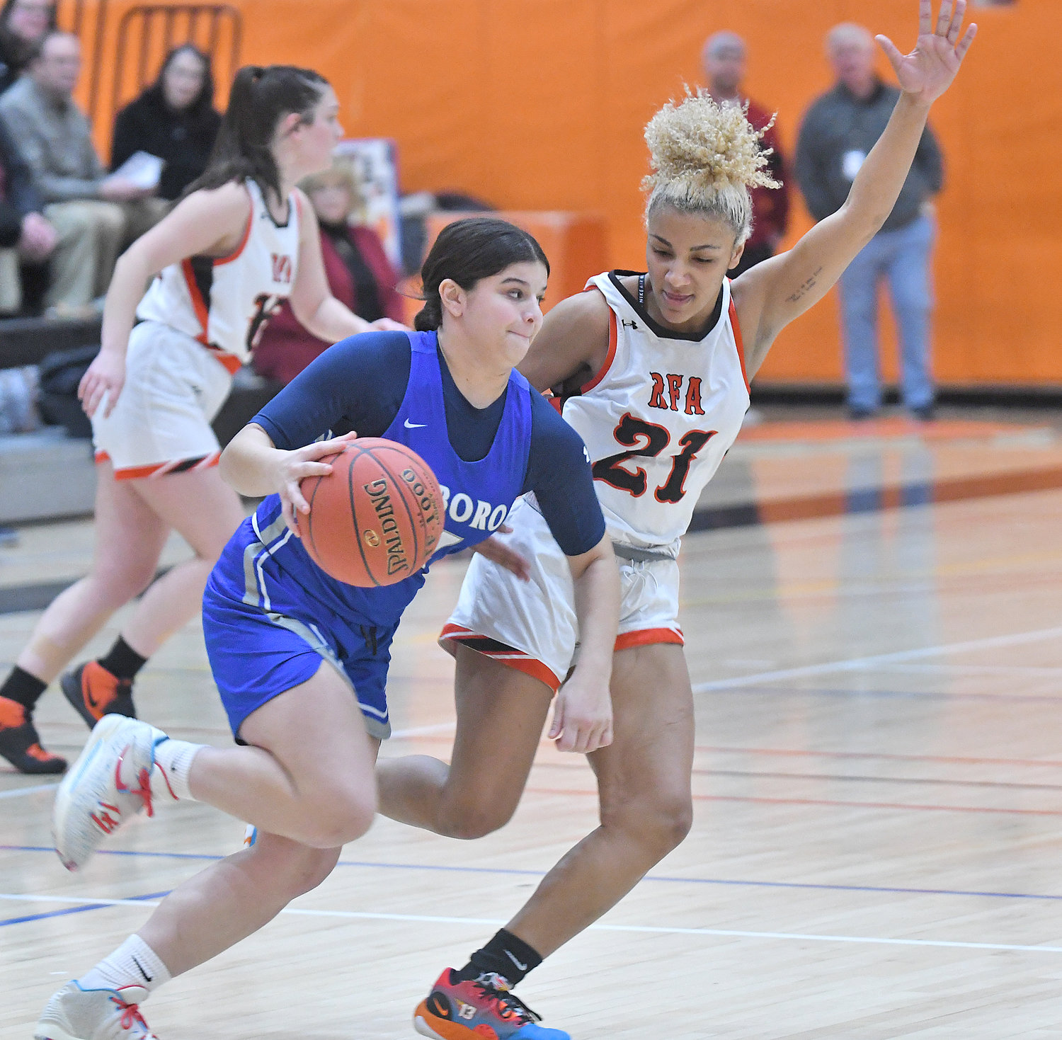 RFA's Amya McLeod guards Whitesboro's Hayley Bostwick in the first quarter at RFA Friday night. McLeod finished with 27 points in the team's 12th consecutive win.