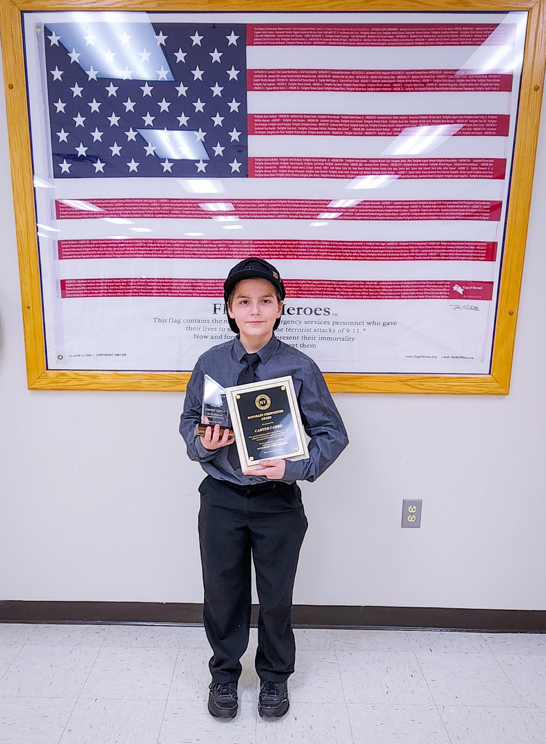 Carter Carro, age 11, of New Hartford, was honored by the Willowvale Fire Department Thursday night for his heroic actions putting out a neighbor's garage fire on Jan. 18. Fire officials said Carro used a fire extinguisher to knock down the flames before they could spread.