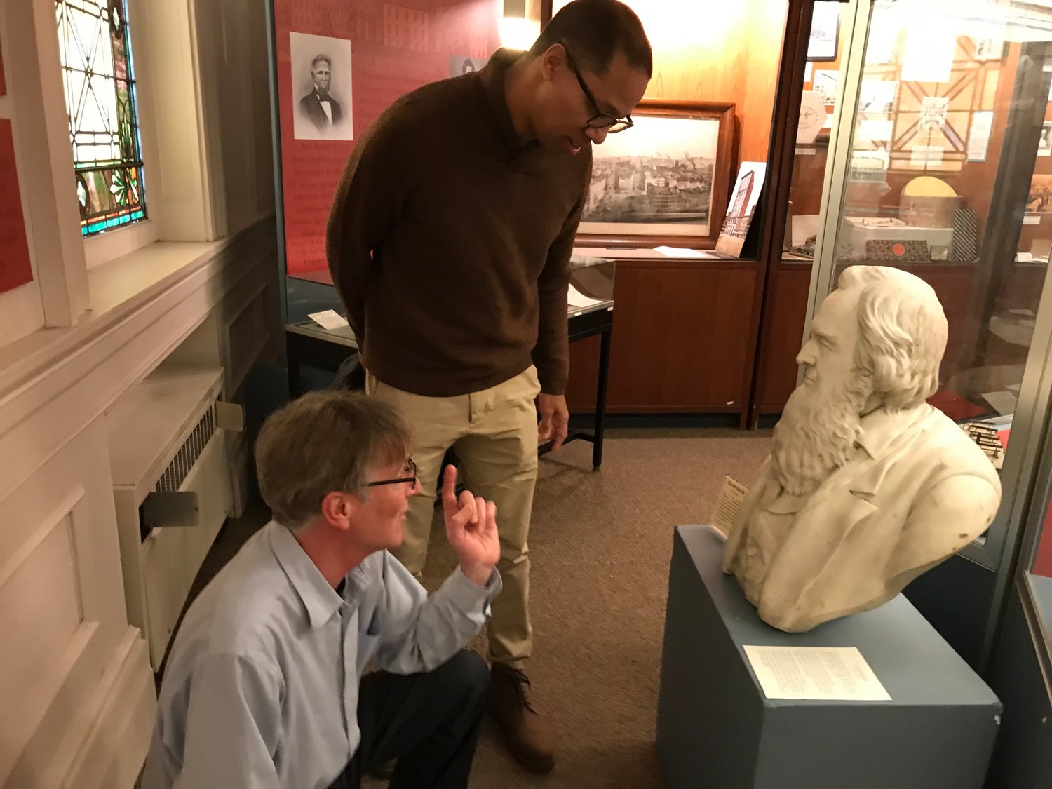 Filmmaker Paul Miller, standing, and Oneida County History Center Director of Public Programs Patrick Reynolds inspect a bust of Gerrit Smith Saturday, Feb. 11 at the Utica museum. That bust was sculpted in 1876.