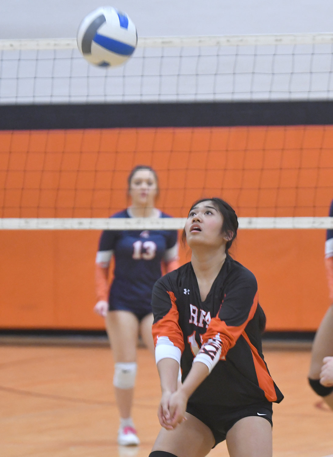 Thylia Keoviengsamay of Rome Free Academy prepares to direct the ball for a return during the Black Knights' Class A semifinal match against visiting East Syracuse Minoa Friday night. Keoviengsamay had 30 assists, six digs, four aces and three blocks in the Knights' four-set win.