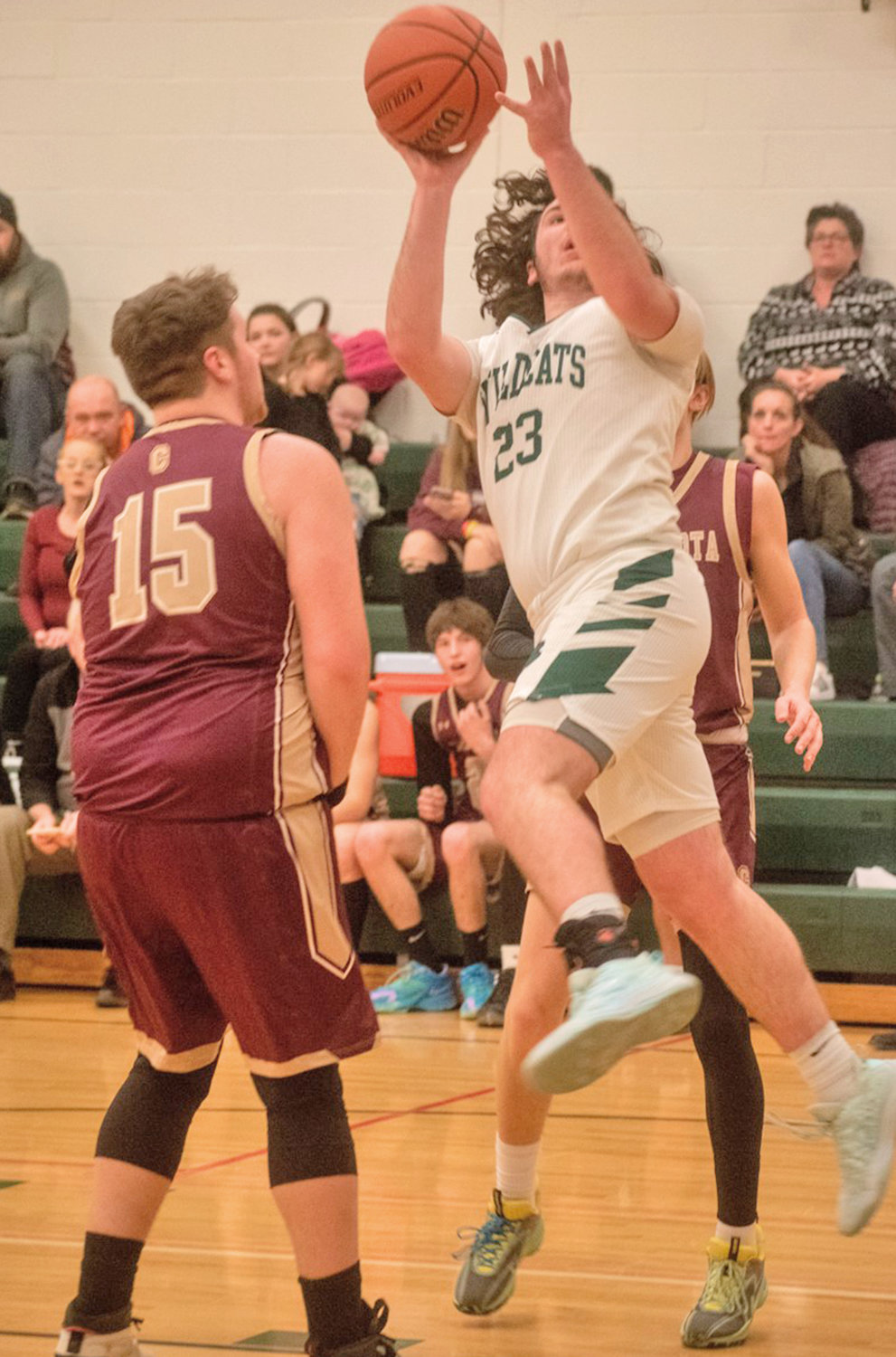 Adirondack's Brett Sanford goes up for a shot in front of Canastota's Caiden Bonneau Friday at home. Canastota won 51-38.
