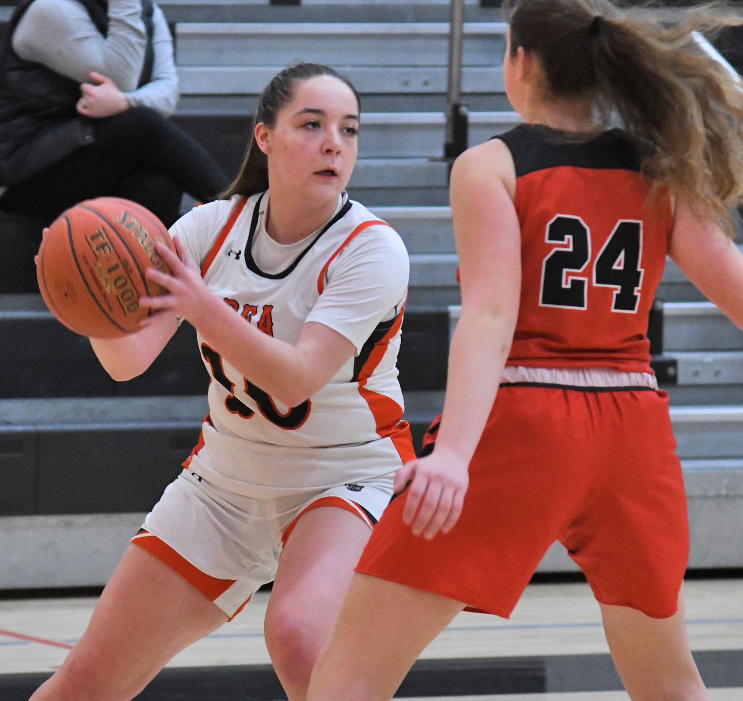 Raelyn Dole of Rome Free Academy looks for a teammate while guarded by Vernon-Verona-Sherrill's Santina Garcia in the first quarter Monday night at RFA. The Black Knights won 66-24.