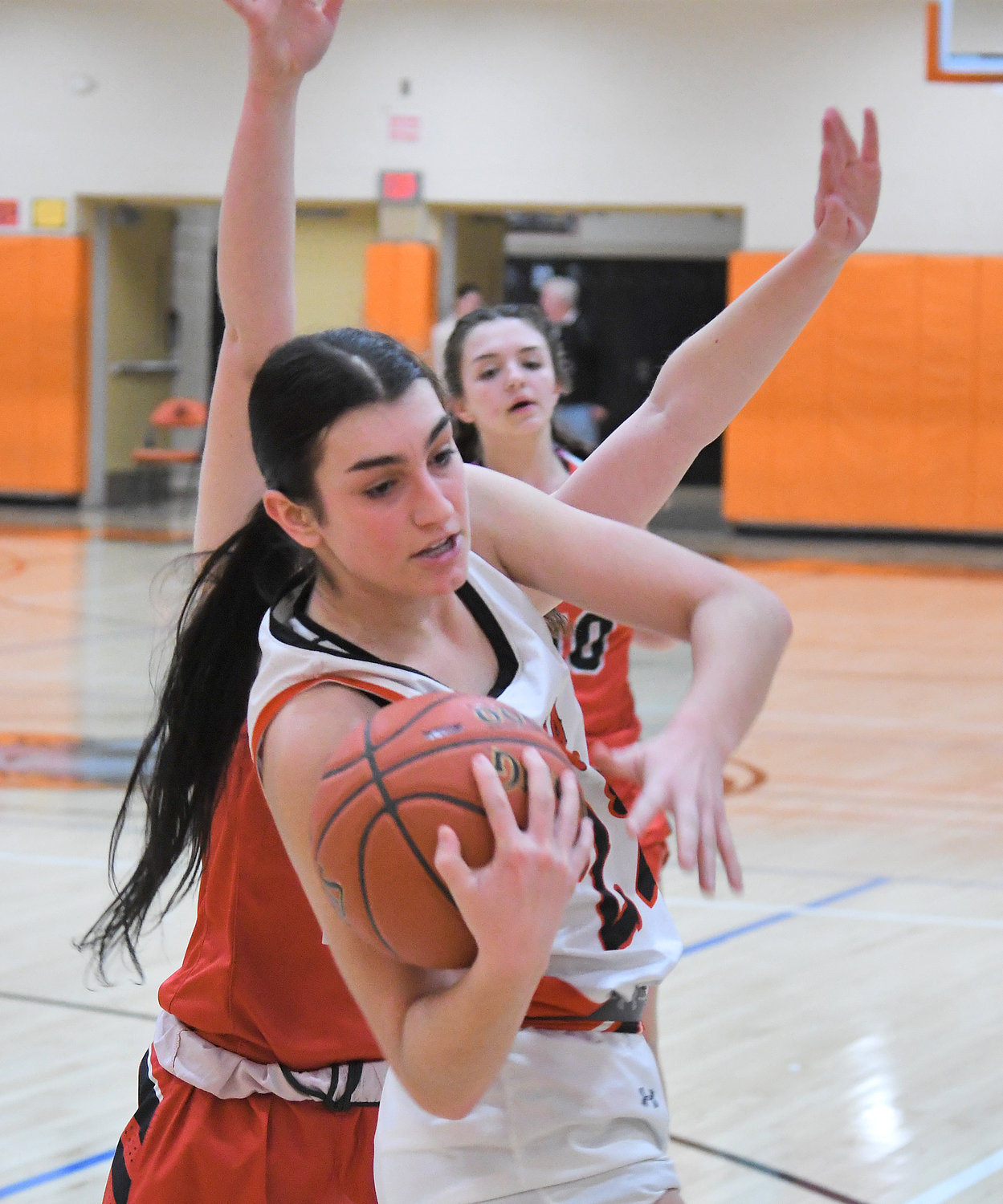 Mia Mirabelli of Rome Free Academy grabs a rebound while guarded by Vernon-Verona-Sherrill's Bailey Faldzinski in the first quarter Monday night at RFA. Mirabelli put up 14 points in a 66-24 win.