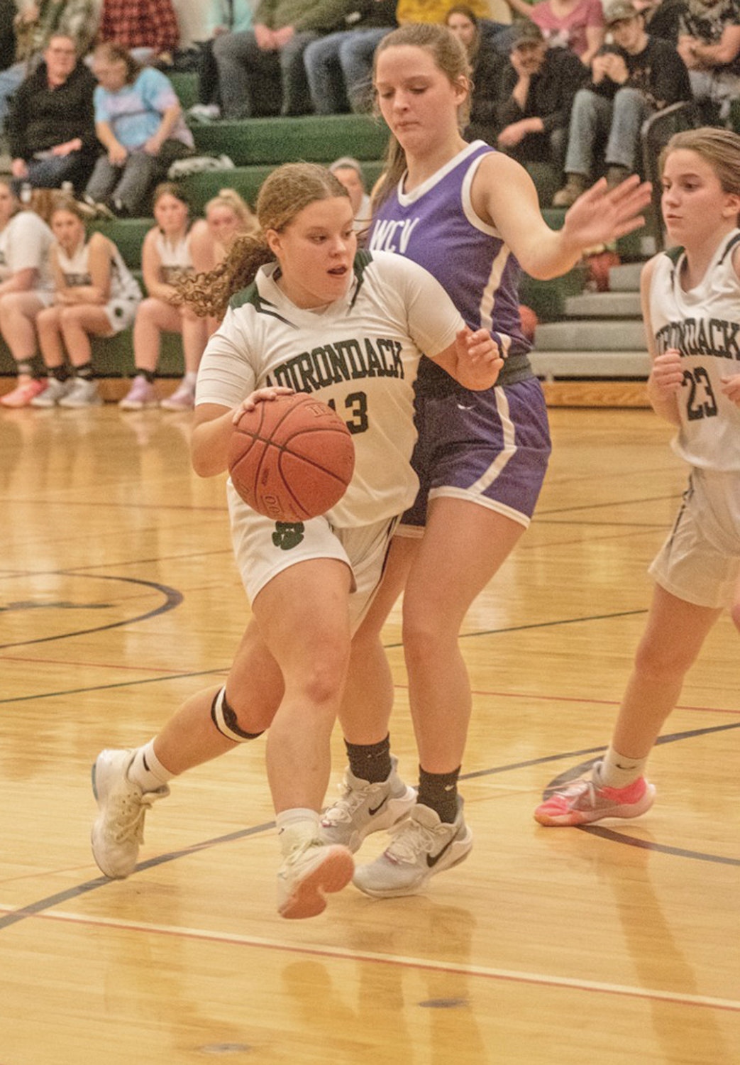 Adirondack's Emma Weiler takes on a West Canada Valley defender Monday at home. Weiler had five points but the Wildcats lost 59-46. At right is Adirondack's Raquel Paschke, who scored four.