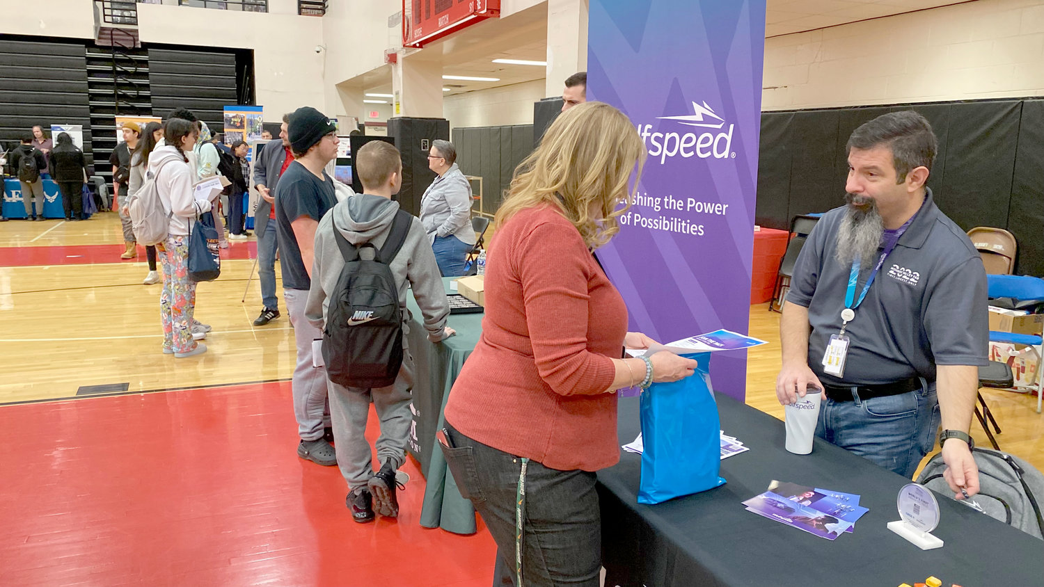 Students at Thomas R. Proctor High School in Utica talk with exhibitors about their job fields during Career Day on Thursday, Feb. 16. The event helps students identify potential future paths and learn about the businesses and industries in Utica and the Mohawk Valley.