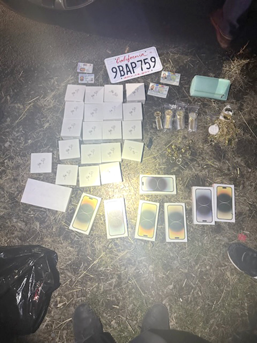 Fake iPods, AirPods and jewelry seized from a couple charged with attempting to scam people at the Walmart in Oneida, according to the Oneida Police Department.