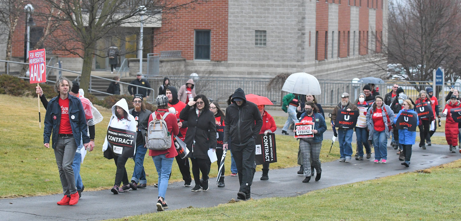 Utica University protesters march away from the Bull Family Board Room Friday, Feb. 17 after all of the Board of Trustees members had arrived on the campus.