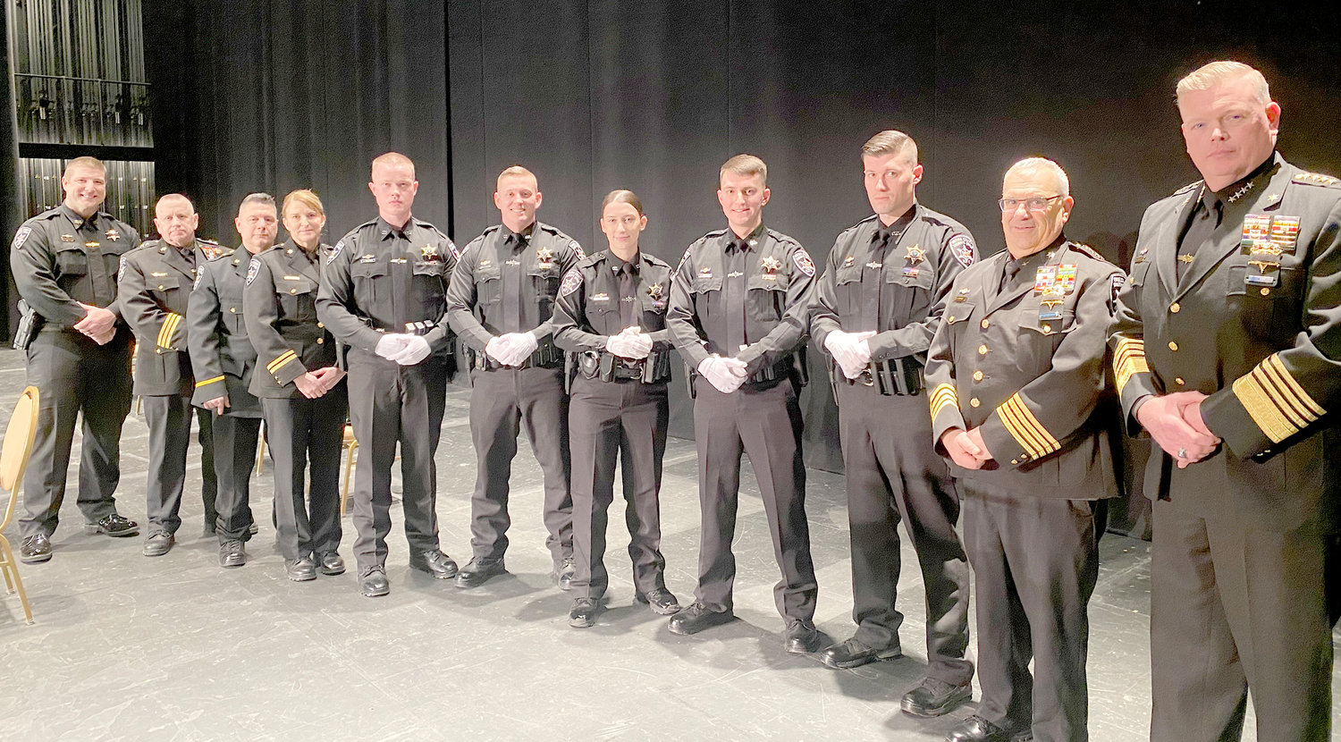 Oneida County Sheriff Robert M. Maciol and Undersheriff Joseph Lisi, at right, pose with new graduates from the Mohawk Valley Police Academy in Utica on Thursday.