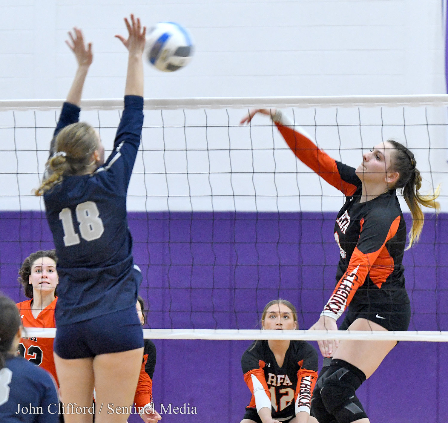 Rome Free Academy #8 Elizabeth Hanba places a kill by Whitesboro #18 Riley Collis Saturday afternoon in Watertown.
