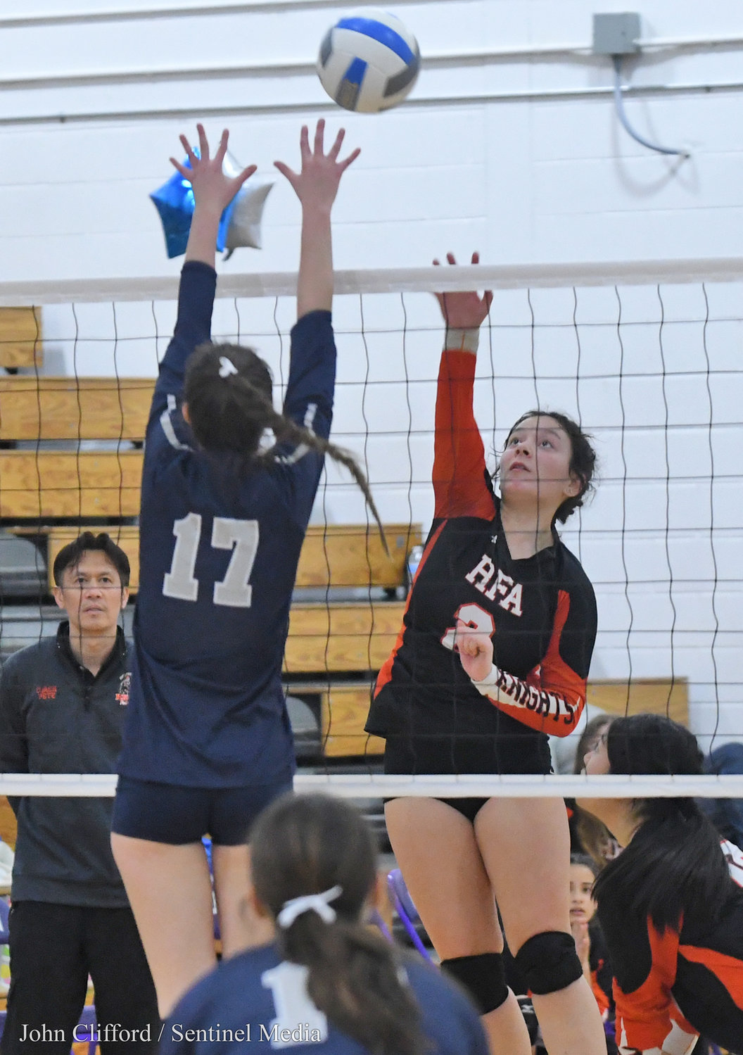 RFA #2 Alyce Frost goes for the kill with Whitesboro #17 Eva Quackenbush blocking Saturday afternoon in Watertown.