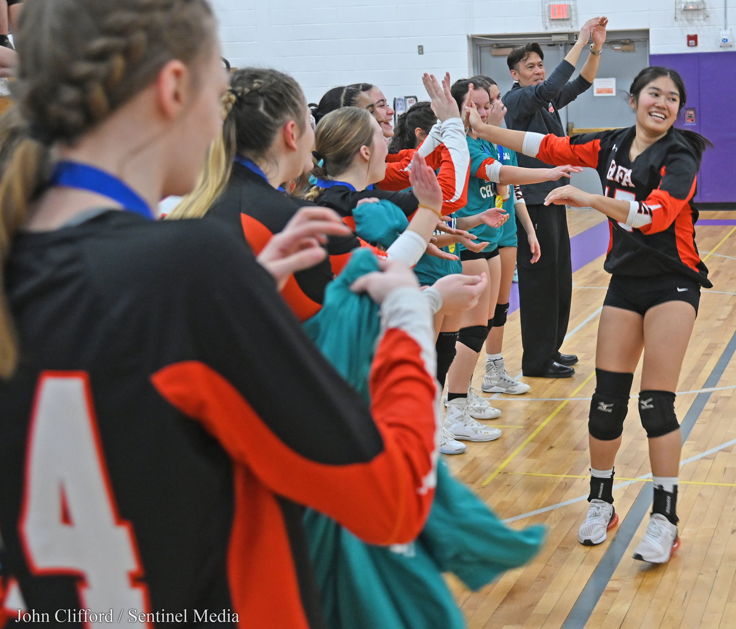 Rome Free Academy Black Knights girls volleyball team celebrate after they defeated Whitesboro in the Class A finals at Case Middle School in Watertown.