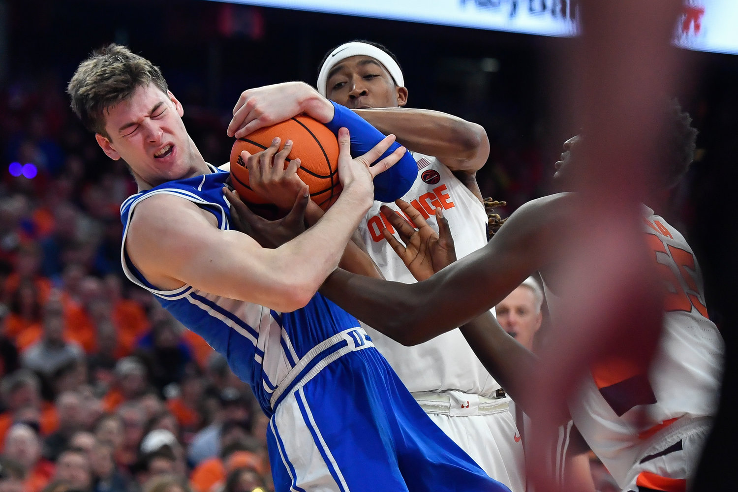 Duke center Kyle Filipowski, left, fights for possession of the ball against Syracuse forward Maliq Brown during the first half of Saturday night's ACC game in Syracuse. Filipowski had 14 points and 12 rebounds as the Blue Devils won 77-55.
