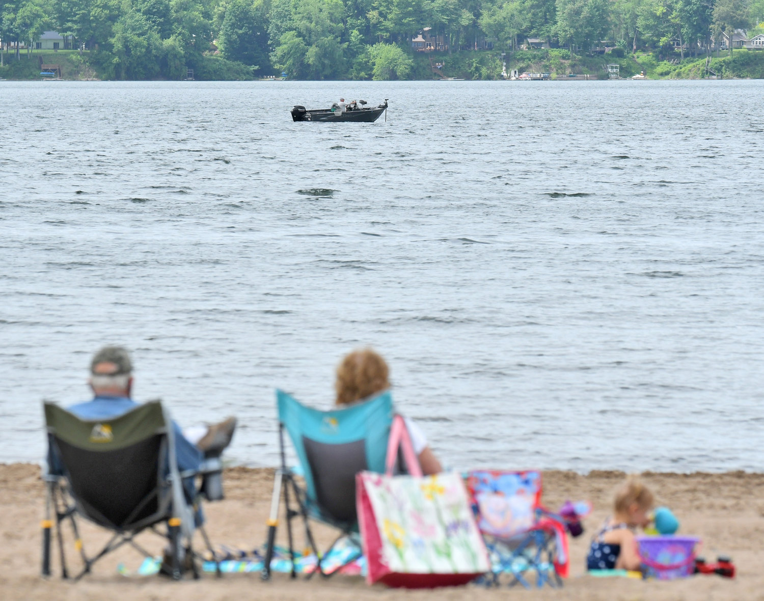 A family enjoys an idle afternoon on the beach at Delta Lake State Park in this May 2022 file photo. With its array of activities for sunbathers, boaters, fishermen and hikers, the popular state park drew 309,577 visitors in 2022, up from 281,411 visitors in 2021.