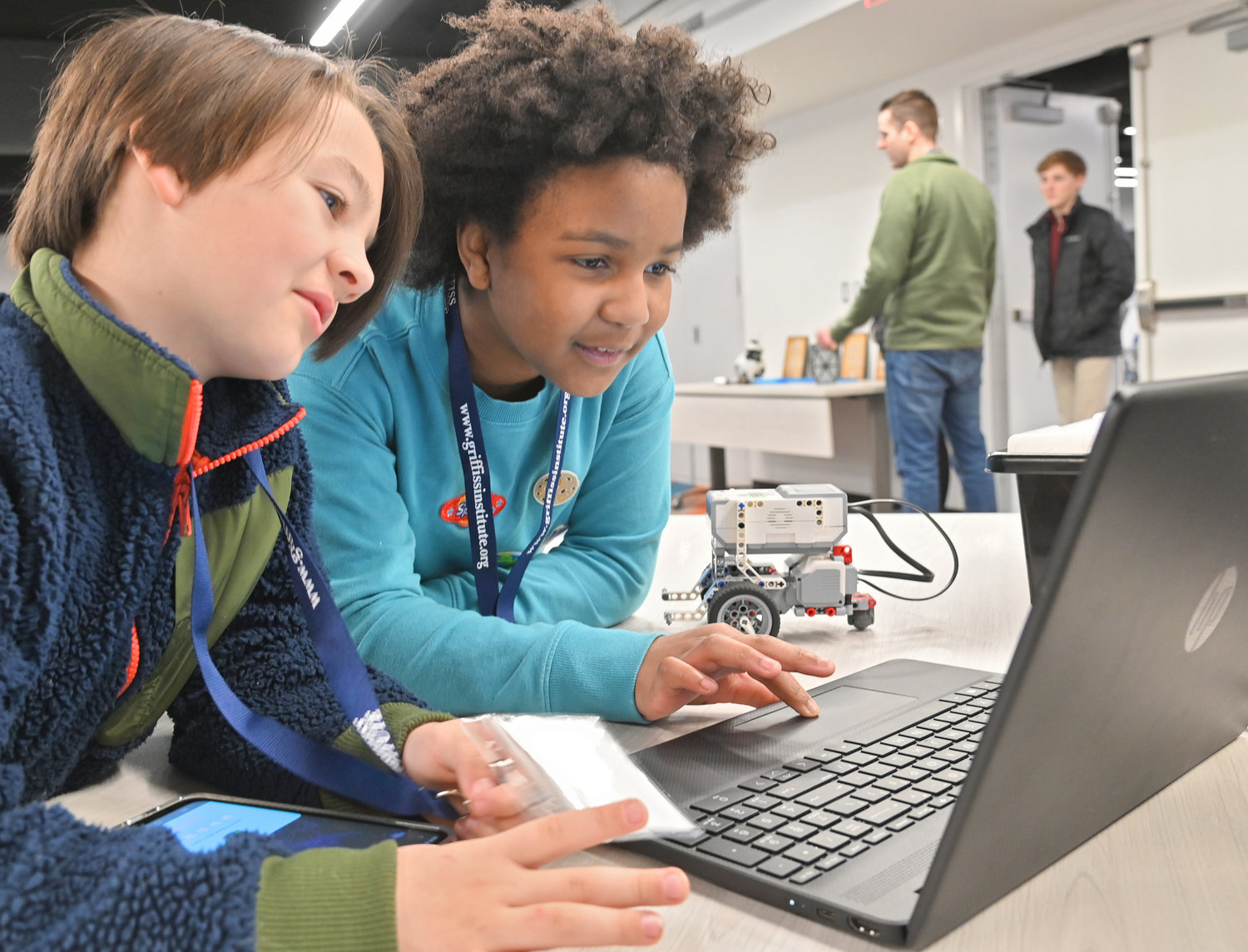 Desmond Thompson and Marli Cook, both fourth graders at Bellamy Elementary School, work on giving their robot personality Tuesday Feb. 21 at Griffiss Institute’s inaugural Robotics Camp in Rome.