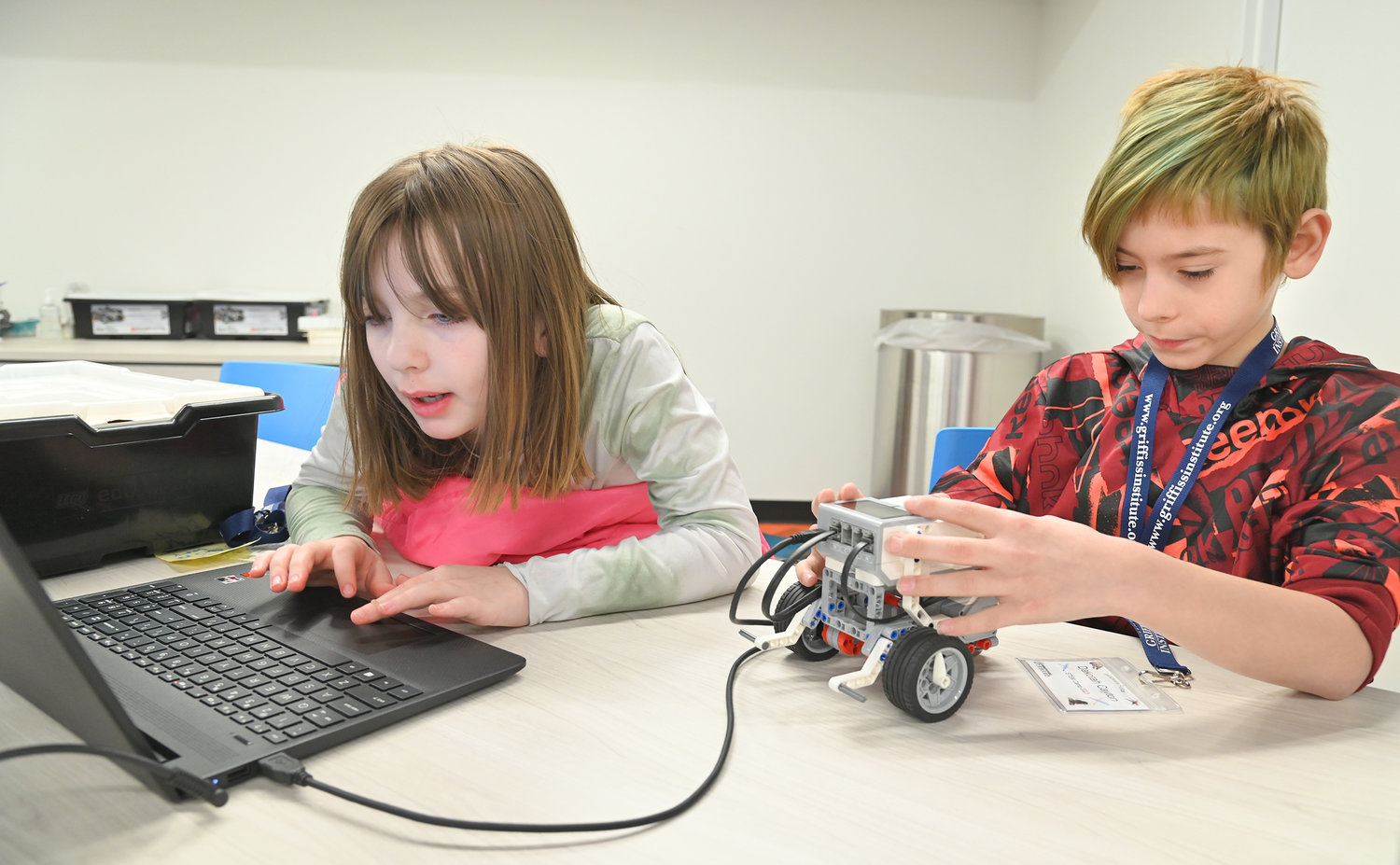 Bellamy Elementary School fourth graders Aubrey Stewart and Dakotah Cayton work on giving their LegoBot personality Tuesday, Feb. 21 at Griffiss Institute’s Robotics Camp in Rome.