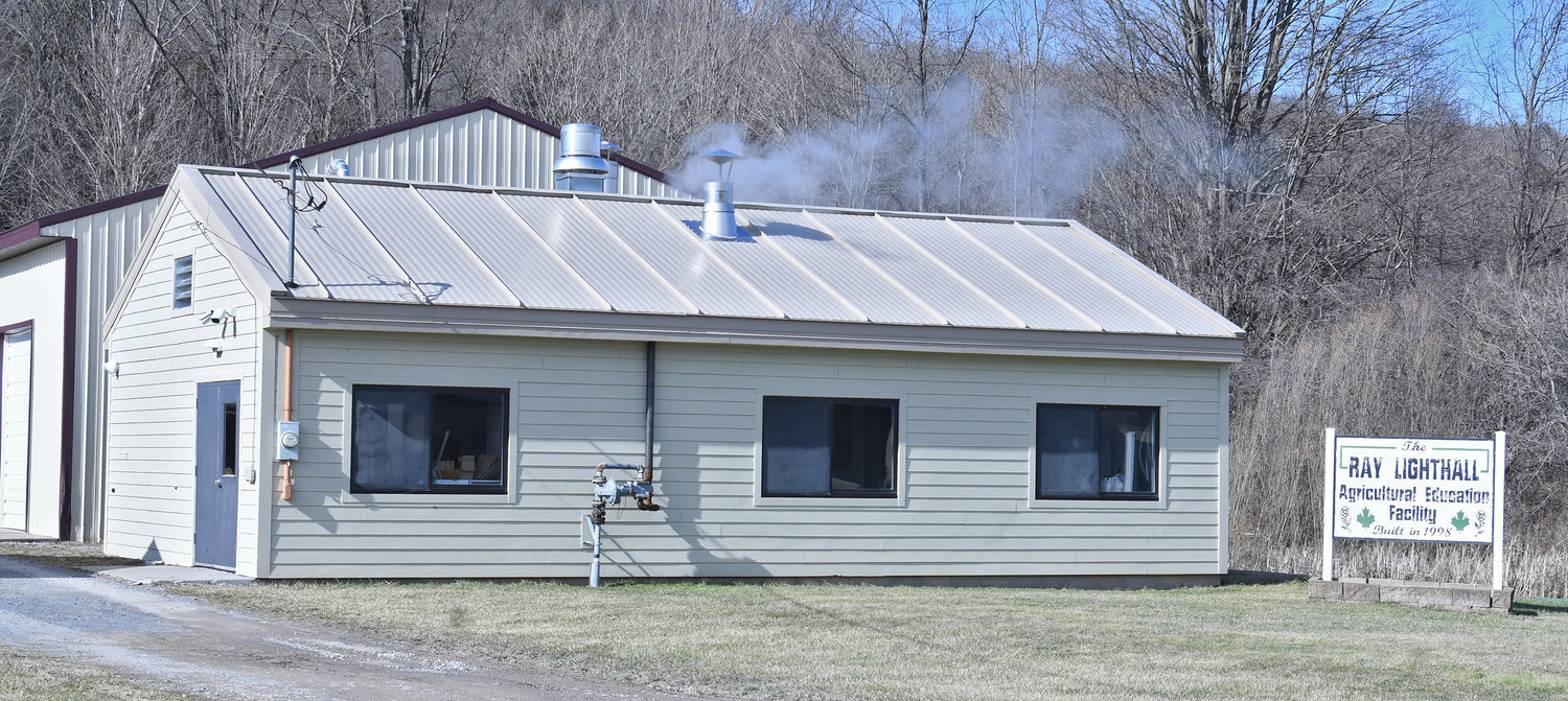 Steam rises from the Ray Lighthall Agricultural Education Facility Wednesday, Feb. 15, a sure sign the Stockbridge Valley FFA is producing their sweet maple syrup at their Munnsville sap house.