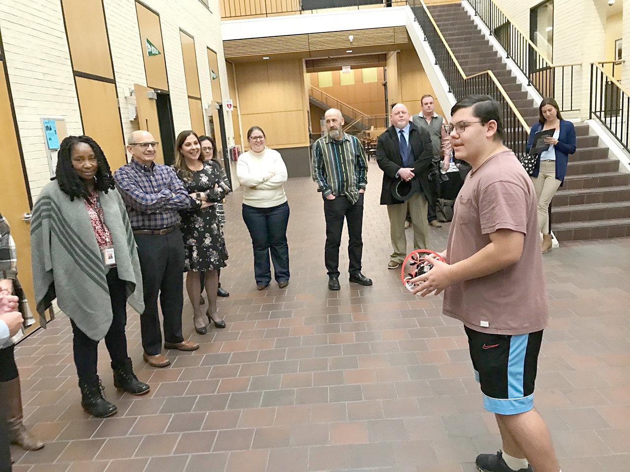 Rome Free Academy junior Tylor Graf, right, tells members of the Rome City School District Board of Education about the Drone Soccer Club Monday, Feb. 13 on the Mohawk Valley Community College's Rome campus.