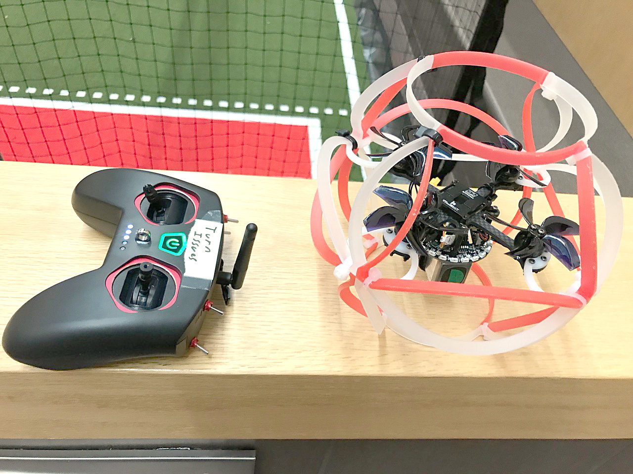 A remote control, left, and the flying quadcopter drone it flies are seen Monday, Feb. 13 during a special presentation by the Drone Soccer Club cooperative program between the Rome City School District and Mohawk Valley Community College for the district's Board of Education.