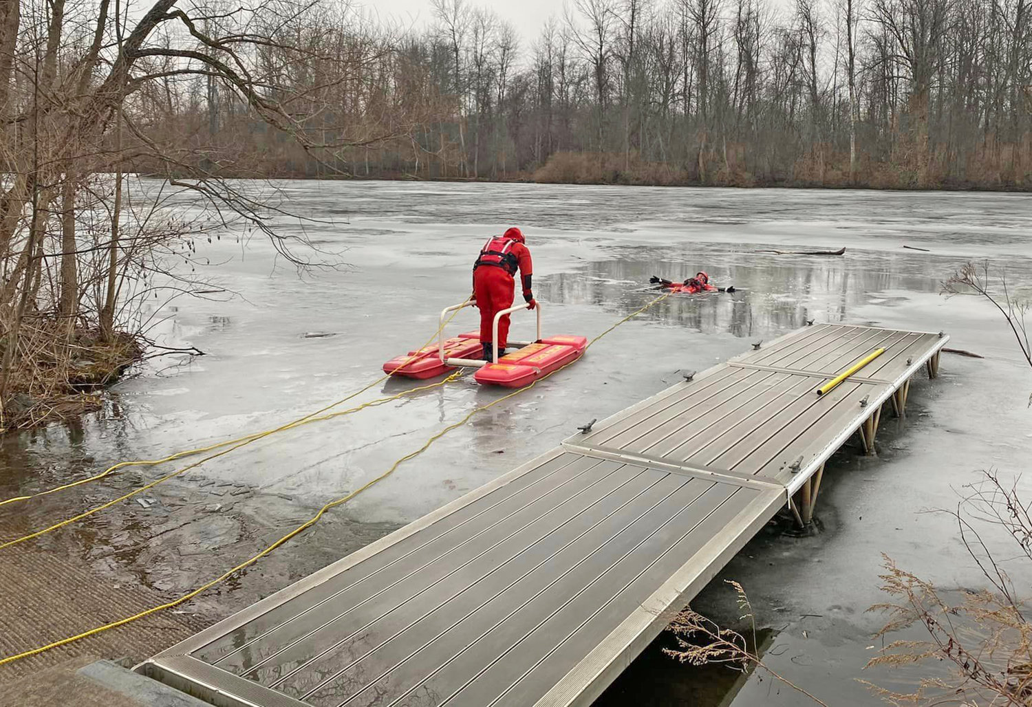 Rome firefighters clad in protective suits practice icy rescues on the Barge Canal Tuesday afternoon. With one trainee in the water, another rides the ice water rescue sled out to save the day.