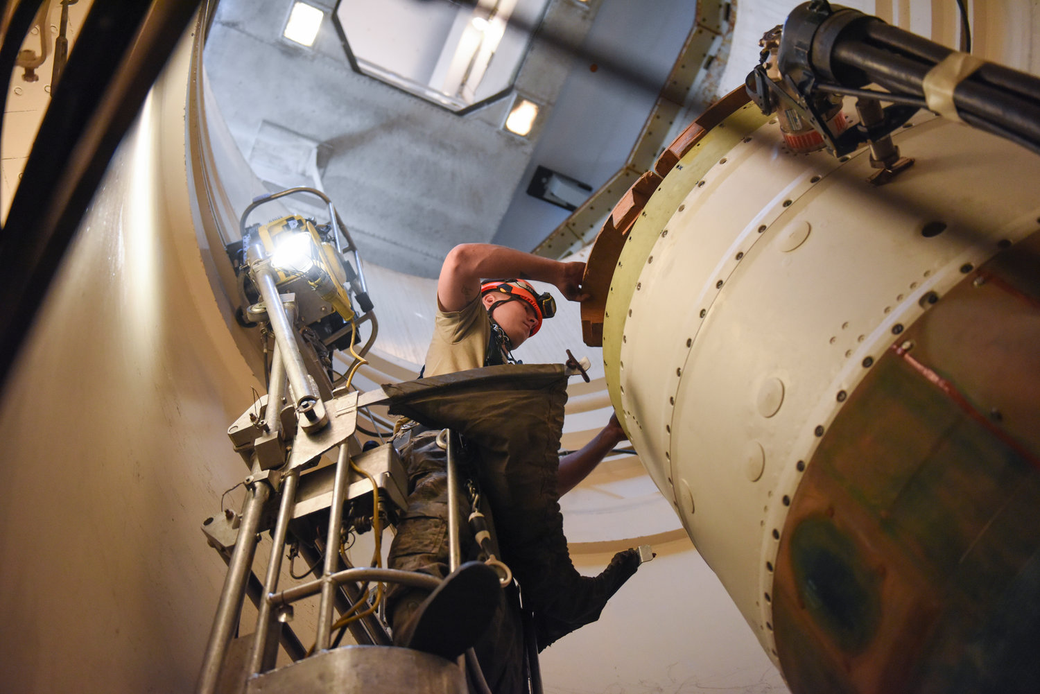 In this image provided by the U.S. Air Force, Airman 1st Class Jackson Ligon, 341st Missile Maintenance Squadron technician, prepares a spacer on an intercontinental ballistic missile during a Simulated Electronic Launch-Minuteman test Sept. 22, 2020, at a launch facility near Malmstrom Air Force Base in Great Falls, Mont. The top Air Force officer in charge of the nation's air and ground-launched nuclear missiles has requested an official investigation into the number of officers who are reporting the same type of blood cancer after serving at Malmstrom Air Force Base. (Tristan Day/U.S. Air Force via AP)