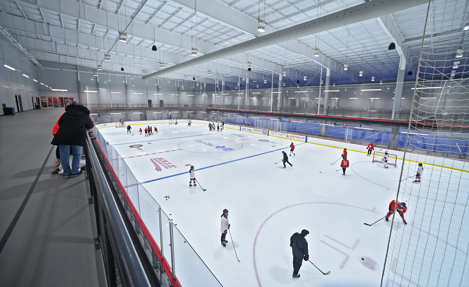 Interior of hockey practice with the soccer field in the background at the Nexus Center on Feb. 1. There also is a walking track around the upper deck.