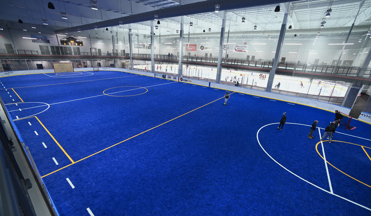 Interior of soccer floor with hocky rink in the background at the Nexus Center on Feb. 1.