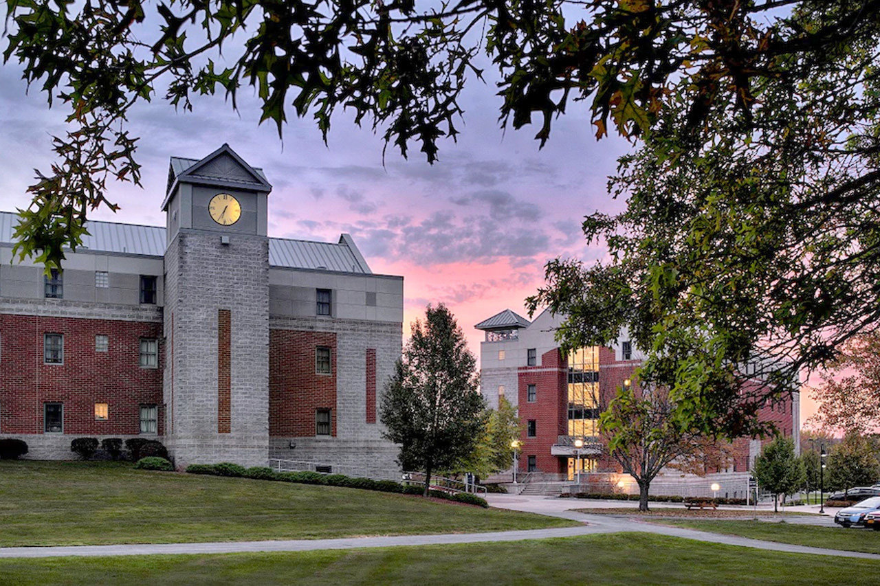 Bell Hall at dusk at Utica University.
