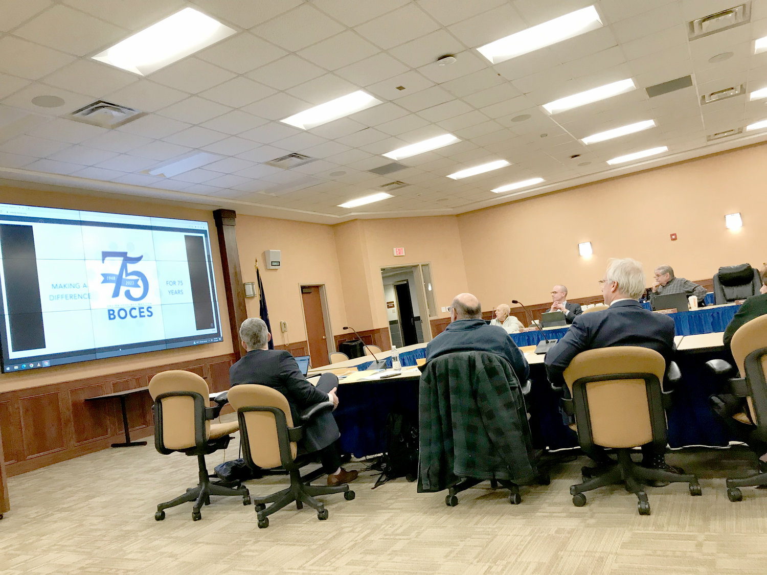 Members of the Cooperative Board of Oneida-Herkimer-Madison BOCES watch a video celebrating its 75th anniversary during their Jan. 11 meeting.