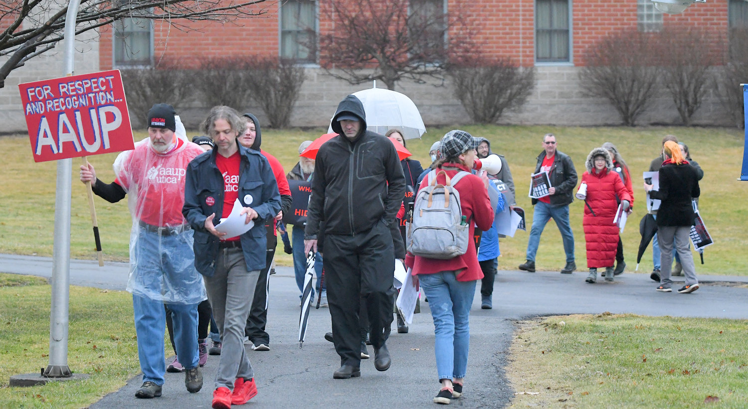 Members of the AAUP-Utica union march Friday, Feb. 17 around the campus at Utica University.