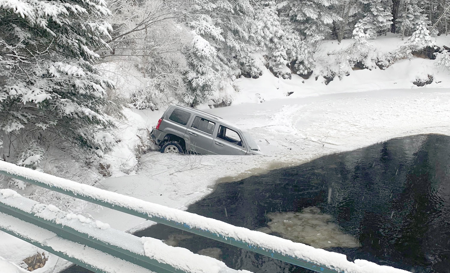 Three people were able to escape after this Jeep crashed into the Moose River in the Town of Webb at about 2 a.m. Sunday, according to the Webb Police Department.
