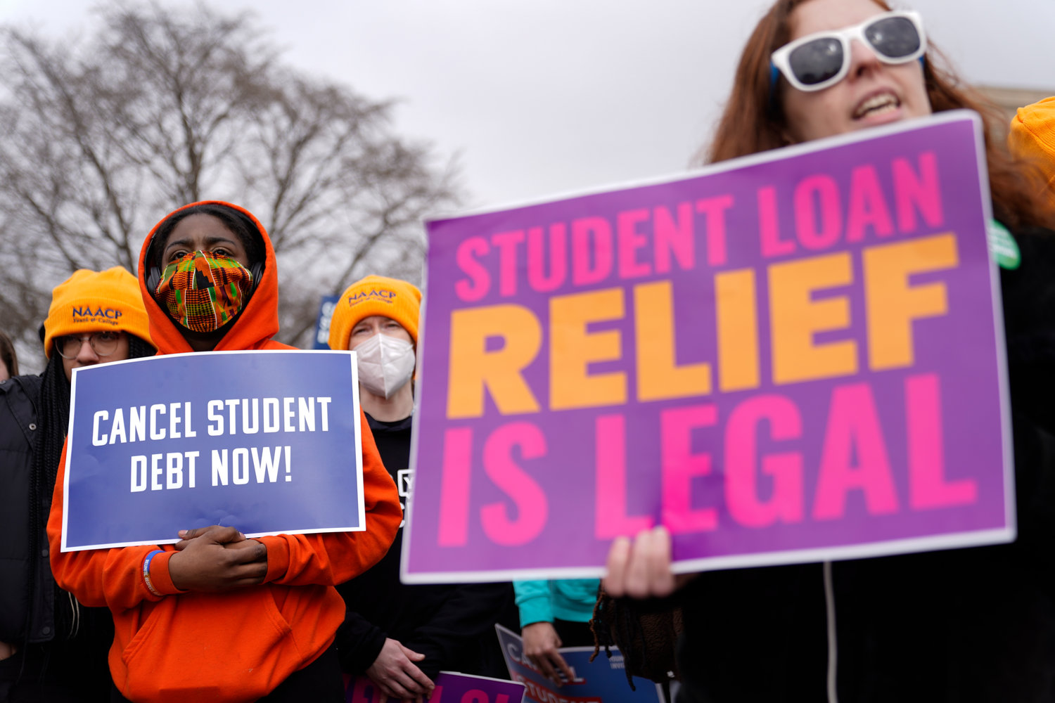 Student debt relief advocates gather outside the Supreme Court on Capitol Hill in Washington, Tuesday, Feb. 28, 2023, as the court hears arguments over President Joe Biden's student debt relief plan.