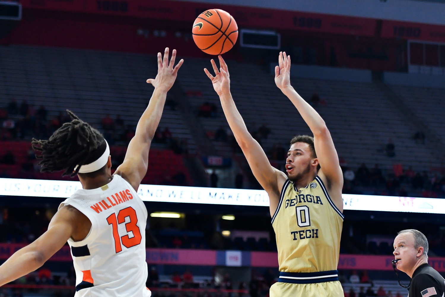 Georgia Tech guard Lance Terry, right, shoots over Syracuse forward Benny Williams during the first half of Tuesday night's game in Syracuse. Terry scored 24 points as the Yellows Jackets won 96-76.