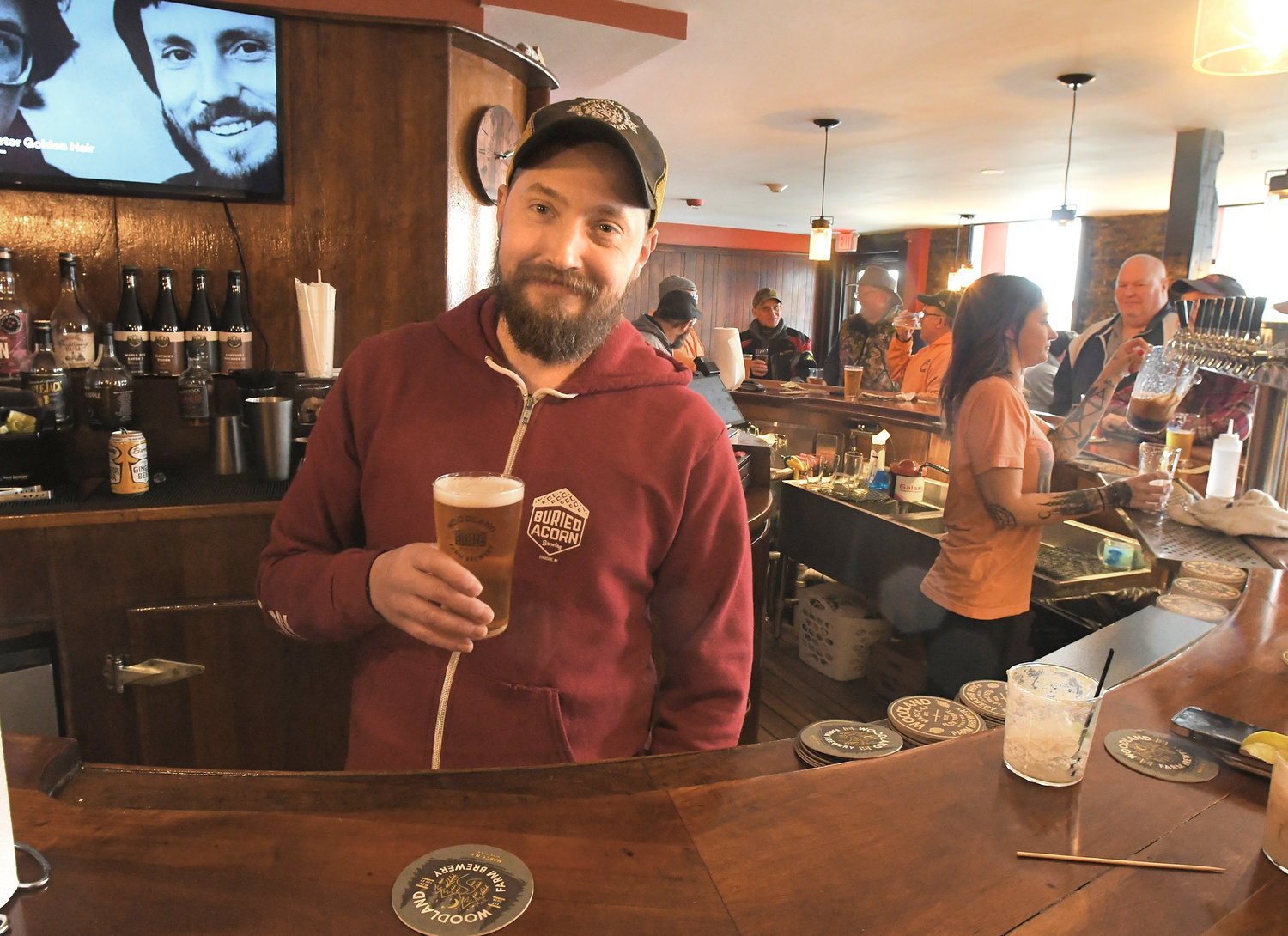 Woodland Farm Brewery owner/brewer Keith Redhead poses with a brew Sunday, Jan. 29 in the new taproom in the Hulbert House in Boonville.