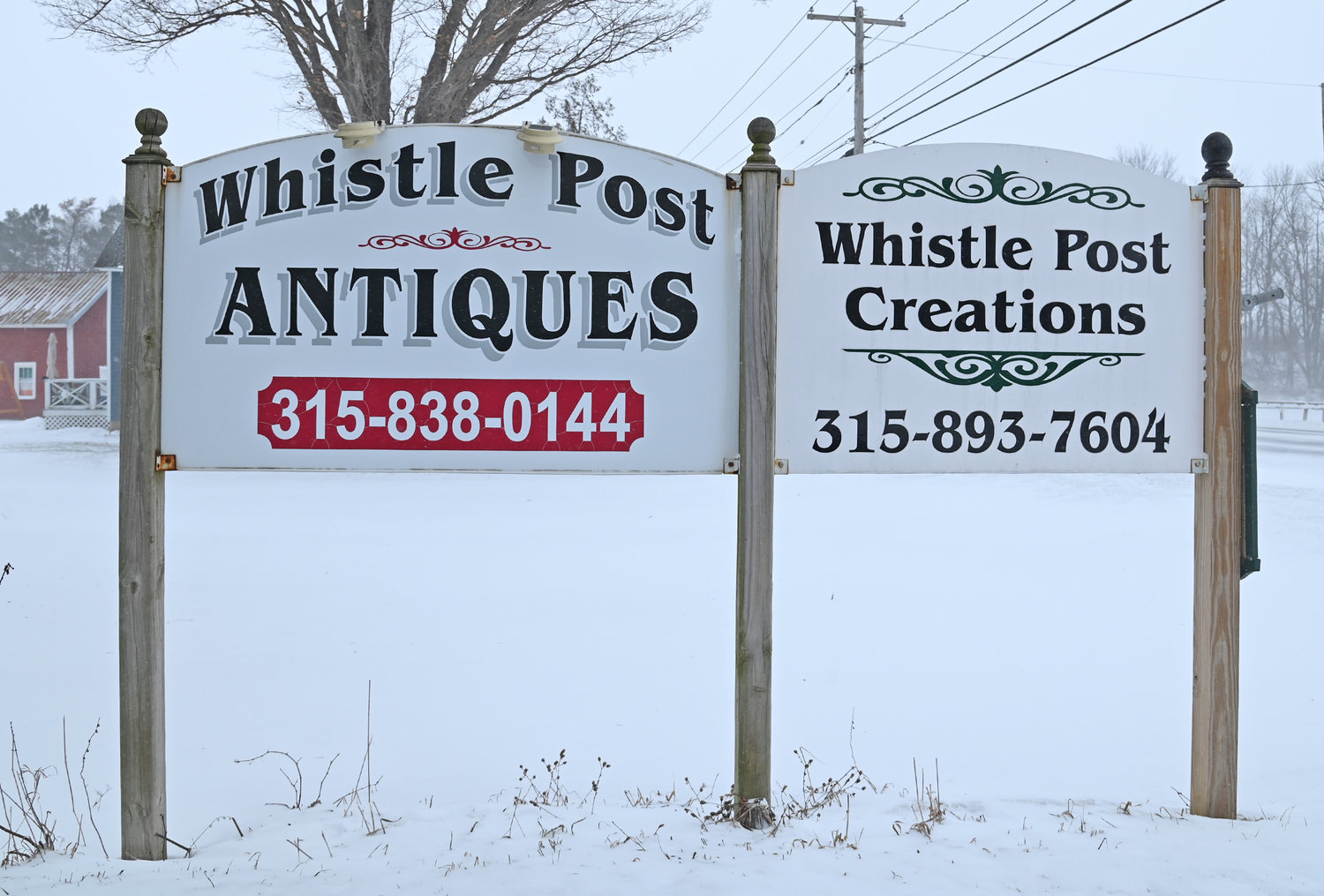 Whistle Post Antiques and Whistle Post Creations signs Friday, Feb. 3 on Route 20 in Bouckville.